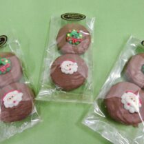 Oreo cookies dipped in chocolate and decorated with Holiday Royal Icing