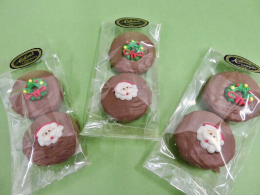 Oreo cookies dipped in chocolate and decorated with Holiday Royal Icing