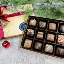 Exquisite box of Artisan Truffles Holiday decorated.